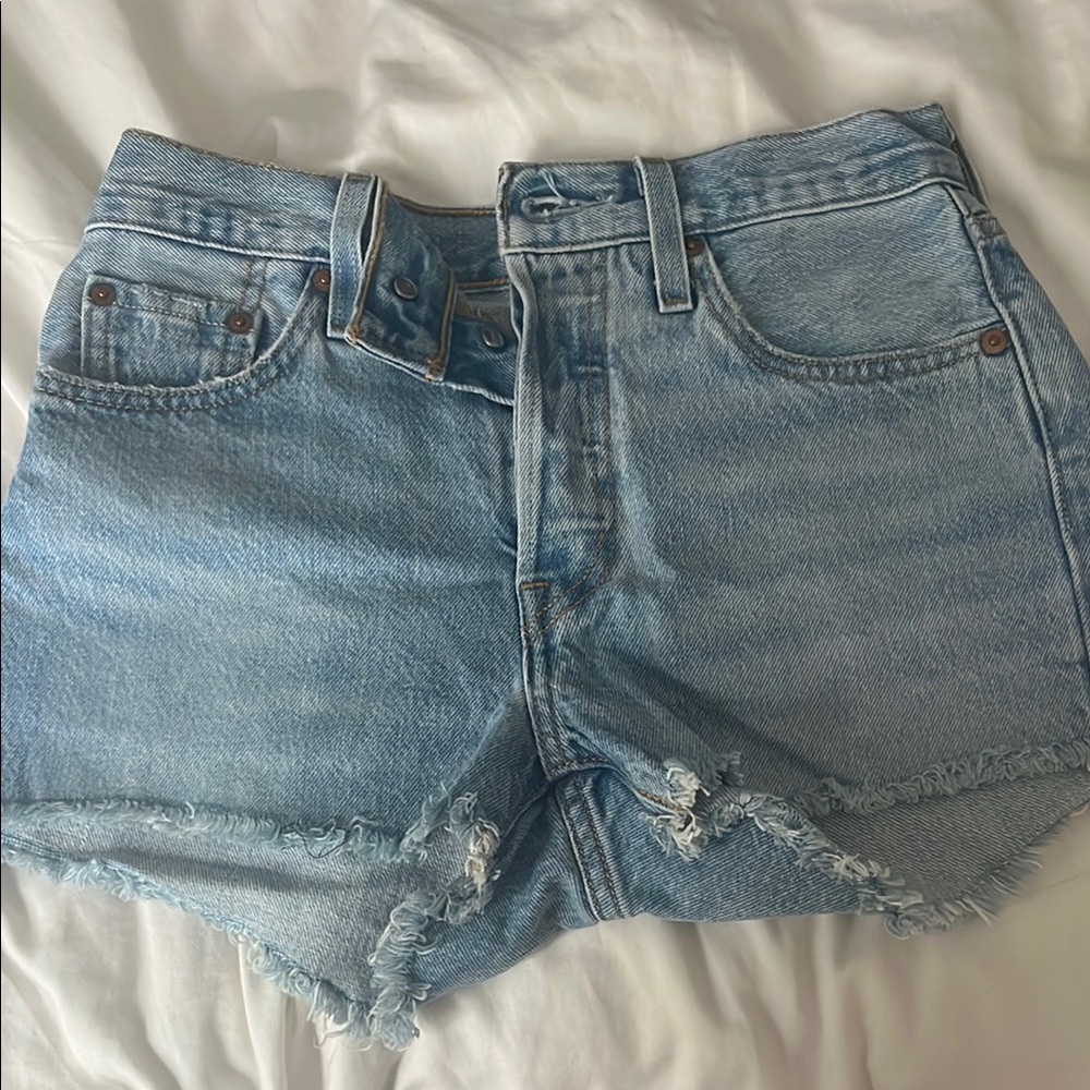 Levi's Blue Jean Shorts with Raw Hem and Distressed Details